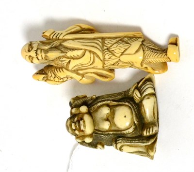 Lot 312 - A Japanese ivory netsuke, Edo period, of a sennin standing holding a staff, a bird on his shoulder