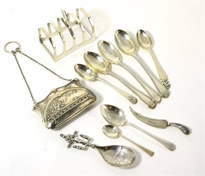 Lot 320 - A silver caddy spoon stamped BM for Berthold Muller, German, a silver purse, a silver toast...