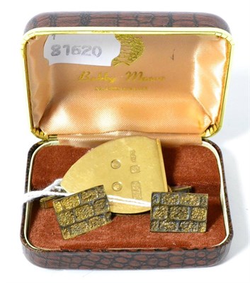 Lot 325 - A 9ct yellow gold money clip, of plectrum form; together with a set of Bobby Moore 22ct gold...