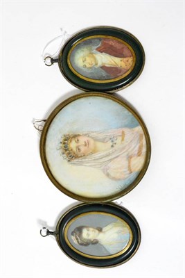 Lot 339 - R Riné, miniature bust portraits of an 18th century lady and gentleman, she with blue dress,...