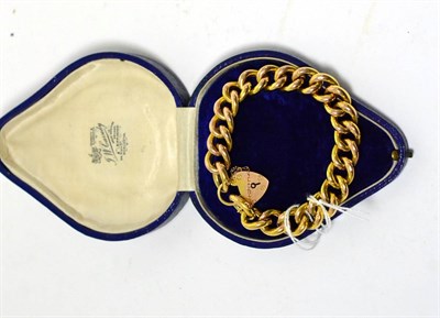 Lot 345 - A link and padlock bracelet, stamped '9C', cased