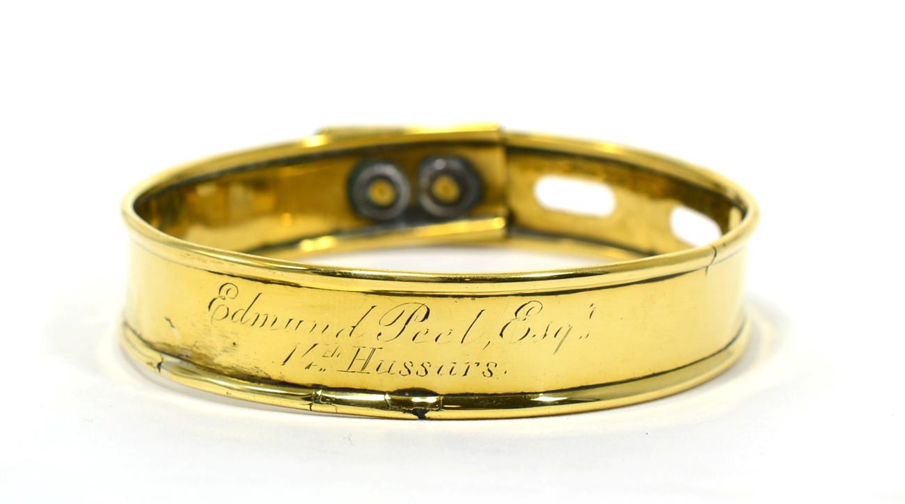 Lot 36 - A Brass Dog Collar, early 19th century, inscribed Edmund Peel Esqr / 14th Hussars, 8.5cm diameter