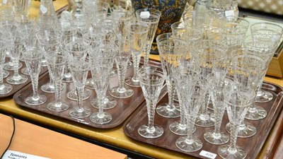 Lot 409 - Suite of Stuart cut glass on four trays, a Metamec clock, two cut glass vases and a Lladro figure