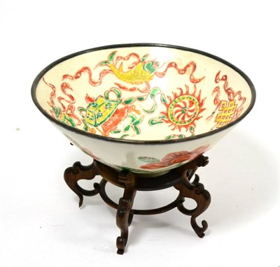 Lot 412 - A Ding type bowl, carved and later enamelled with precious objects, the exterior with sprigs...