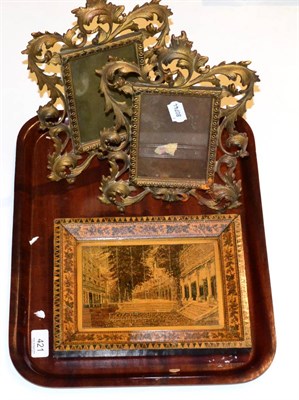 Lot 421 - A 19th century Tunbridgeware picture and frame with a pair of cast frames (3)