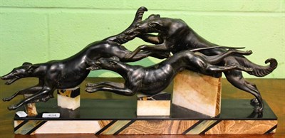 Lot 434 - An Art Deco style metal group of three running dogs