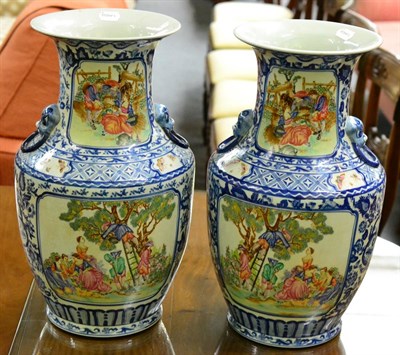 Lot 435 - A pair of Chinese baluster vases, polychrome panels with European scenes, underglaze blue and white