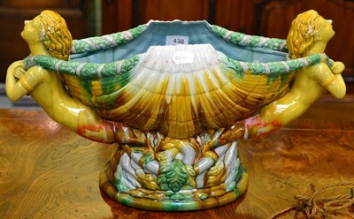 Lot 438 - A majolica shell shaped pedestal vase with figural handles