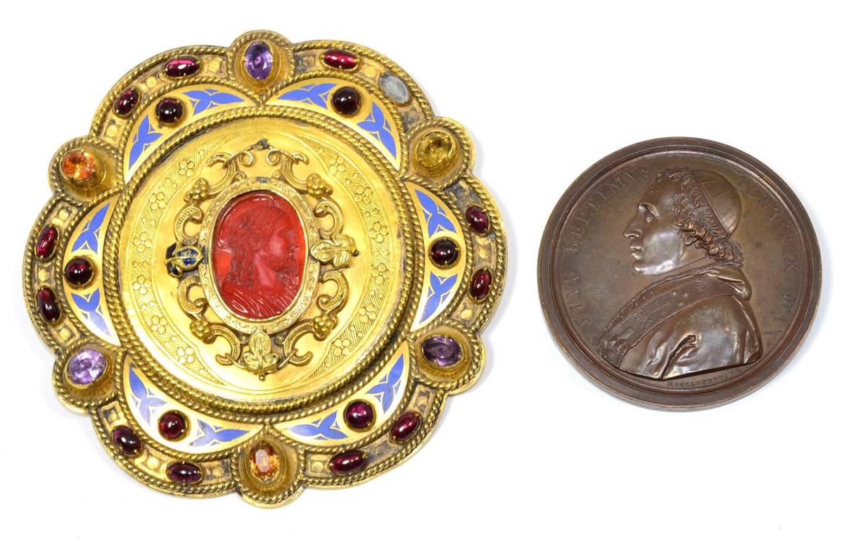 Lot 49 - A Gilt Metal Buckle, dated 1854, of lobed circular form, set with a central carnelian cameo, garnet