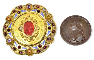 Lot 49 - A Gilt Metal Buckle, dated 1854, of lobed circular form, set with a central carnelian cameo, garnet