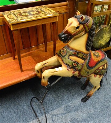 Lot 1038 - A painted and carved wooden carousel horse, on stand, 99cm in height; together with a Swiss musical