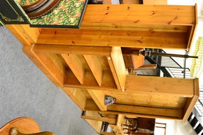 Lot 1050 - A large pine free standing bookcase and two other pine bookcases