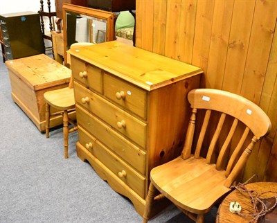 Lot 1052 - A filing cabinet, a pine blanket box, a large pine mirror, pine chest of drawers and two pine...