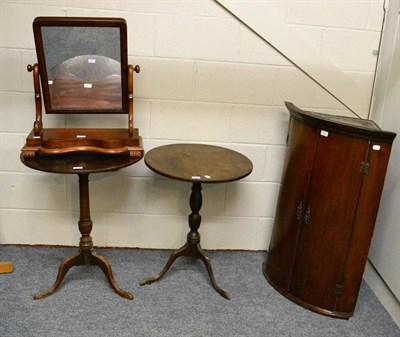 Lot 1054 - A Georgian mahogany bow front corner cupboard, two Georgian oak tripod tables and a Victorian...