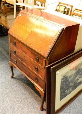 Lot 1057 - A 1930's veneered writing desk