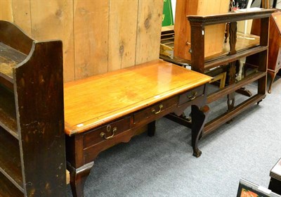 Lot 1058 - A 19th century mahogany ";smallboy"; three drawer side table and a 19th century oak delft rack (2)