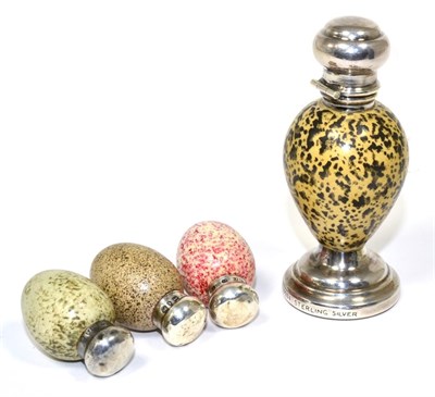 Lot 57 - A White Metal Mounted Macintyre Porcelain Scent Bottle, circa 1900, modelled as an egg, on a...