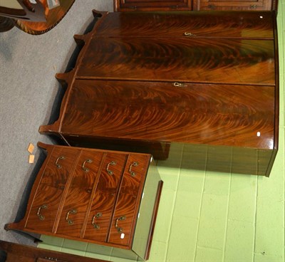 Lot 1116 - A 20th century bow front wardrobe and matching chest