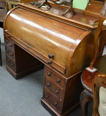 Lot 1131 - A Victorian mahogany roll top desk