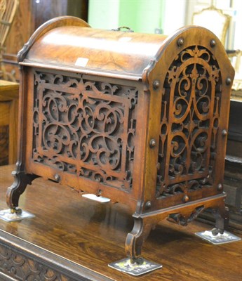 Lot 1137 - A walnut and mahogany Canterbury on castors