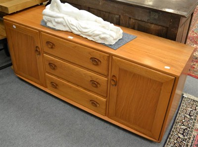 Lot 1141 - An Ercol Windsor elm wood sideboard, after a design by Lucian Ercolani