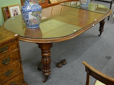 Lot 1151 - A mahogany D-end wind-out table