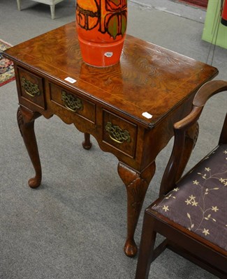 Lot 1154 - A reproduction burr elm lowboy