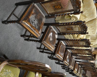 Lot 1169 - A set of eight oak dining chairs with bergere backs on front barley twist legs