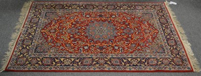 Lot 1171 - A finely knotted Isfahan rug, central Iran, the crimson field of scrolling floral vines around...