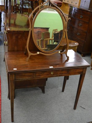 Lot 1183 - An early 19th century mahogany fold over tea table, together with a 19th century toilet mirror