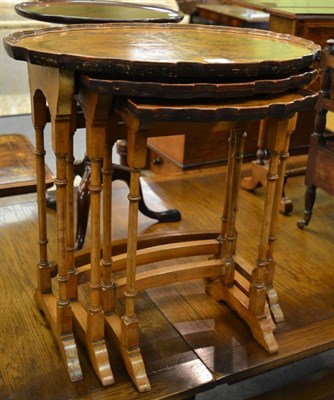 Lot 1185 - A reproduction walnut veneered nest of tables and another nest of tables