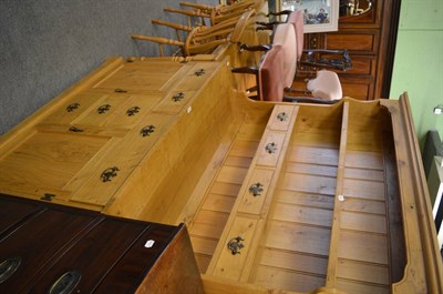 Lot 1189 - A light oak kitchen table, four chairs together with a dresser and rack