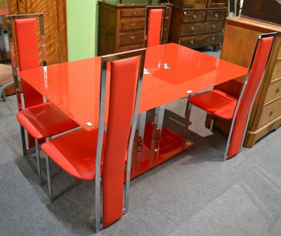 Lot 1195 - A red glass table and four chairs