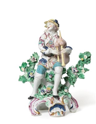 Lot 71 - A Bow Porcelain Figure of a Bagpiper, circa 1770, modelled wearing a yellow hat and floral...