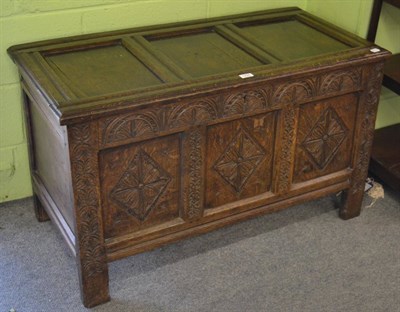 Lot 1206 - An 18th century carved oak coffer