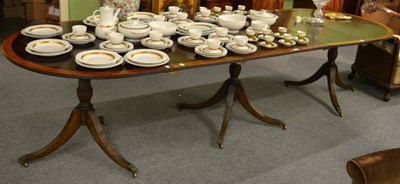 Lot 1207 - A mahogany extending dining table with two leaves