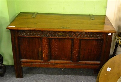 Lot 1211 - A carved oak chest