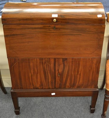 Lot 1218 - An early 19th century and later mahogany cellarette, with domed lift lid, opening to reveal...