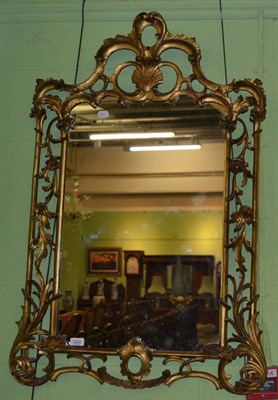 Lot 1220 - A 19th century scroll decorated gilt wood framed mirror