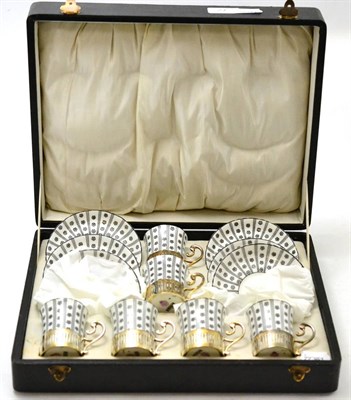 Lot 27 - A cased Royal Worcester six piece silver mounted coffee set, comprising six cups and saucers,...