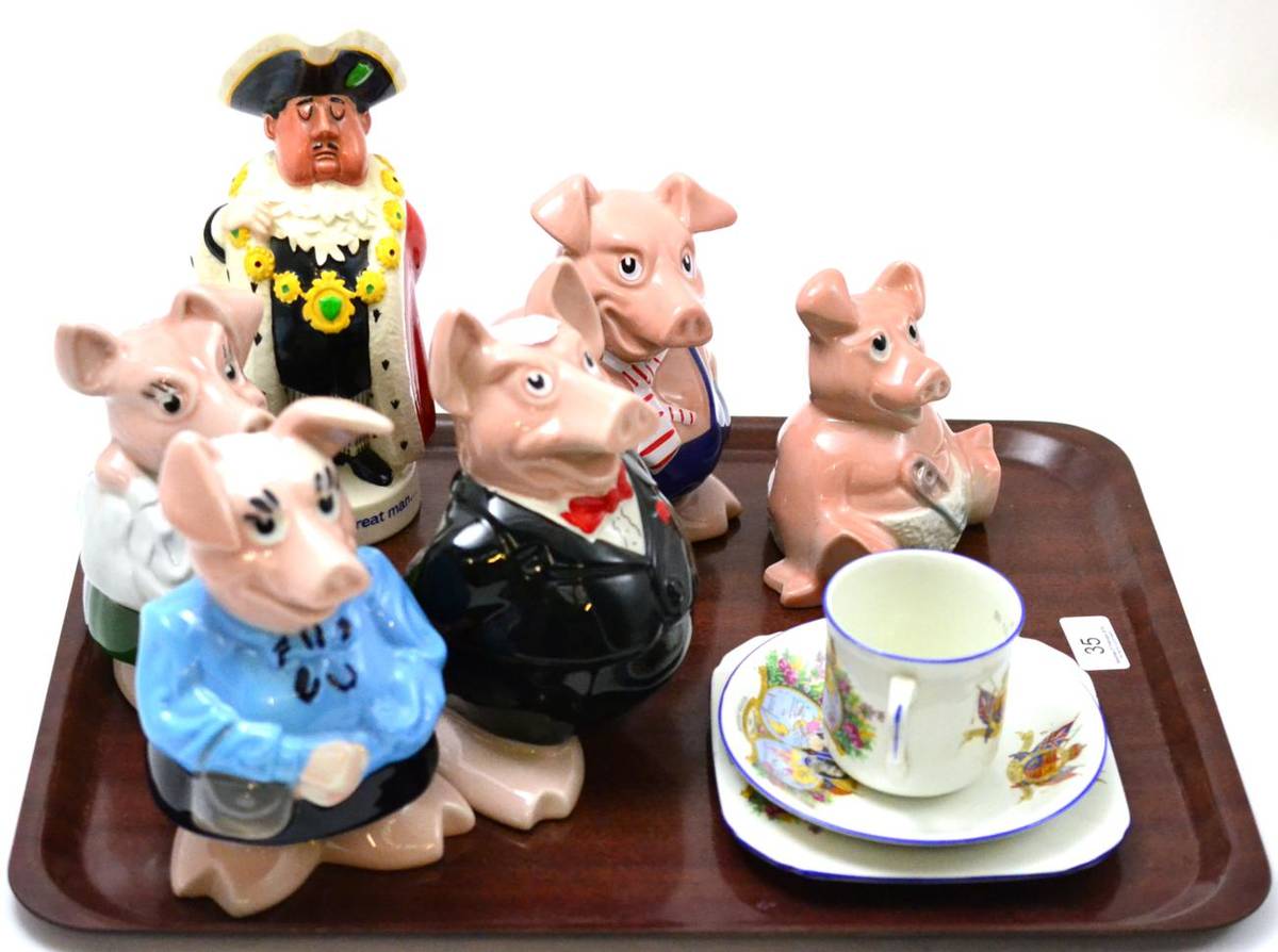 Lot 35 - A collection of five Wade pottery pigs, Beswick Worthington's ales promotional jug and a Royal...