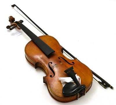Lot 58 - A German copy of a Stradivarius violin with two piece back and a bow