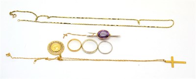 Lot 72 - A 22ct gold band ring, a 9ct gold band ring, an amethyst set brooch stamped '9CT', a cross on chain