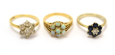 Lot 74 - A 9ct gold opal flower head cluster ring, together with an 18ct white gold sapphire and diamond...