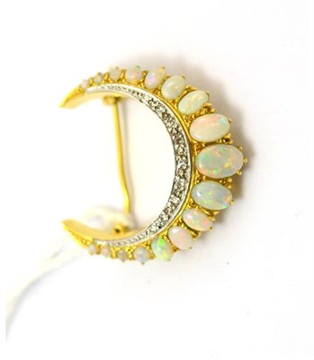 Lot 100 - An 18ct opal and diamond crescent moon brooch