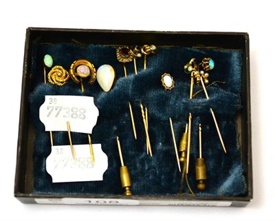 Lot 108 - A group of tie pins including an opal mounted 9ct pin, a seed pearl mounted pin stamped 10ct, three