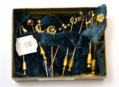 Lot 109 - A group of seed pearl mounted tie pins including a 9ct pin, a 15ct gold pin, an 18ct gold pin...