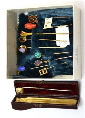 Lot 110 - A group of tie pins including two Victorian coral and gold examples, one in the form of a boars...