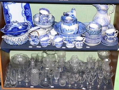 Lot 127 - A quantity of 19th century and later glass and blue and white wares (on two shelves)