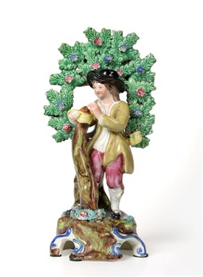 Lot 86 - A Staffordshire Pottery Figure of a Tree Grafter, possibly Walton, circa 1820, the standing...